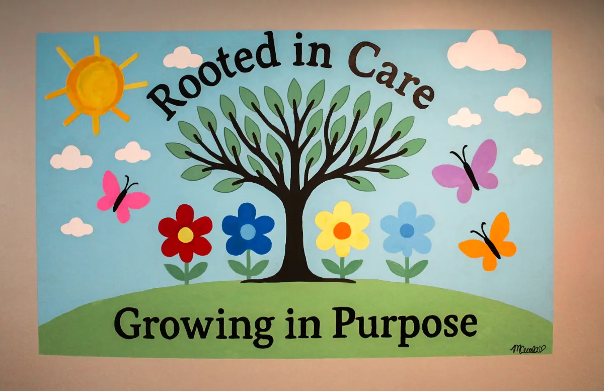 Rooted in Care, Growing in Purpose mural at our center
